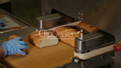 Cutting a loaf of bread into pieces and packing
