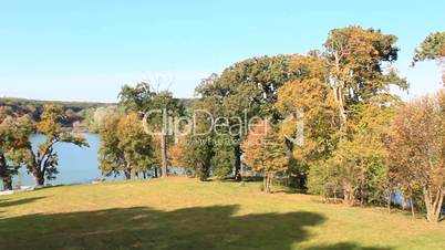 beautiful lake in the forest and tree with yellow leaves in autumn