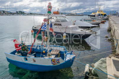 Boat decorated for Christmas in the port of Aegina, Greece.