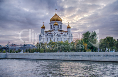 Moscow summer landscape with river and church of Christ Saviour.