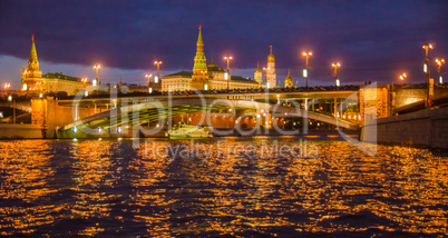 Moscow night landscape with river and kremlin.