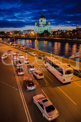 Moscow night landscape with road and river and church of Christ