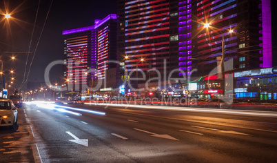 Moscow night cityscape with street traffic.