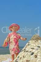 Little girl on a sea beach