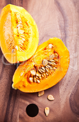 A slice of fresh Pumpkin on wooden table.