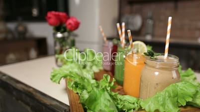 Tray with assortment of smoothies in jars