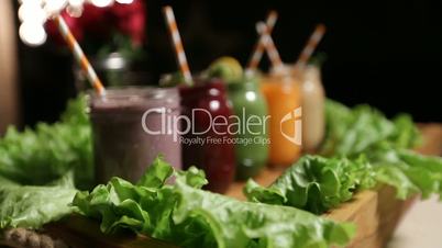 Jars of various smoothies with straws for dieting