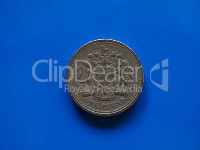 One Pound (GBP) coin, United Kingdom (UK) over blue