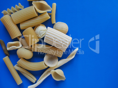 Traditional Italian pasta, blue background with copy space