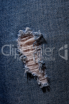 Texture of blue holey jeans