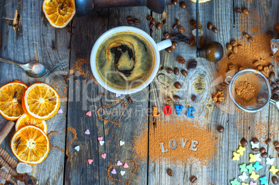 Black coffee in a cup on a gray wooden surface
