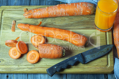 Fresh carrots on the chopping board for the carrot juice