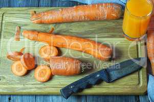 Fresh carrots on the chopping board for the carrot juice