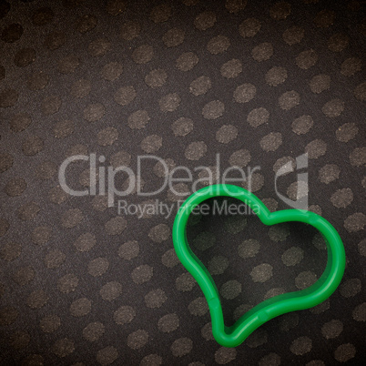 Green plastic heart shape