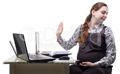 Lazy young pregnant woman at work