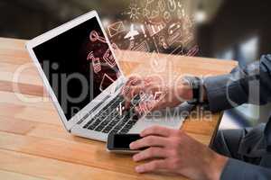 Composite image of cropped image of businessman using laptop
