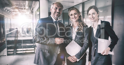 Happy businesspeople smiling at office