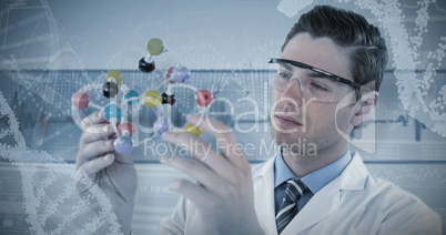 Composite image of scientist experimenting molecule structure