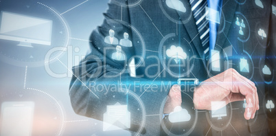 Composite image of businessman checking smart watch