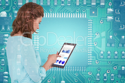 Composite image of businesswoman using tablet over white background