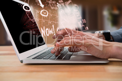 Composite image of cropped image of businessman typing on laptop