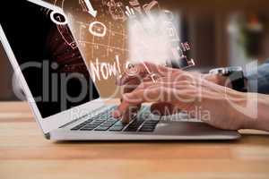 Composite image of cropped image of businessman typing on laptop