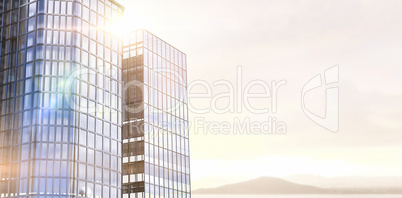 Composite image of low angle view of glass building