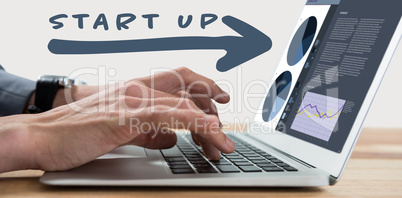 Composite image of cropped image of businessman typing on laptop