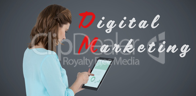 Composite image of businesswoman using tablet over white background