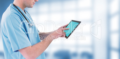 Composite image of surgeon using futuristic digital tablet