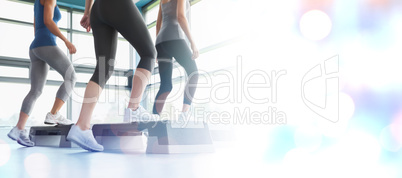 Composite image of three women doing aerobics