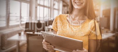 Female business executive using digital tablet