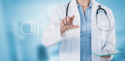 Composite image of cropped image of female doctor holding digital tablet while using invisible scree