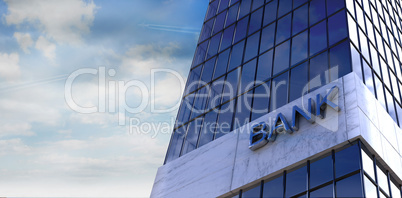 Composite image of reflection of sky on modern building