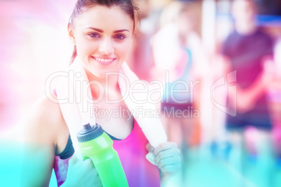 Composite image of smiling woman with towel and bottle