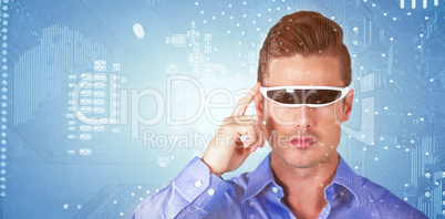Composite image of handsome man with virtual video glasses