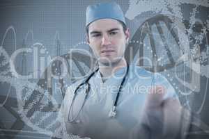 Composite image of surgeon pretending to be using futuristic digital screen