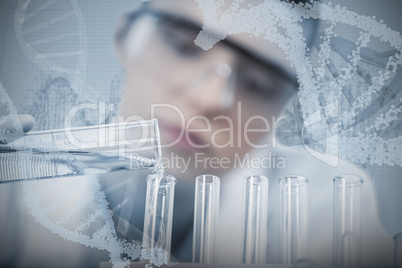 Composite image of female scientist pouring chemical