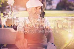 Composite image of cheerful golfer driving cart