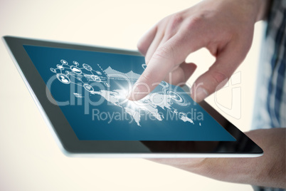 Composite image of cropped hands of man using digital tablet