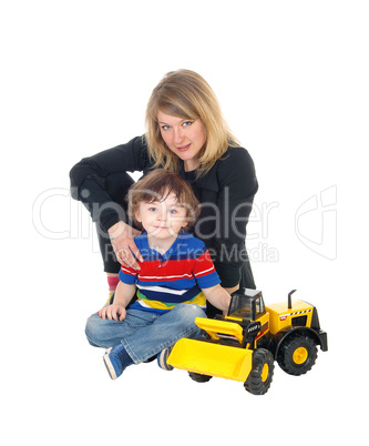 Mother and son sitting on floor.