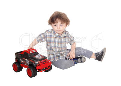 Sweet three year boy playing with his truck.