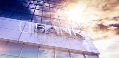 Composite image of low angle view of bank text building
