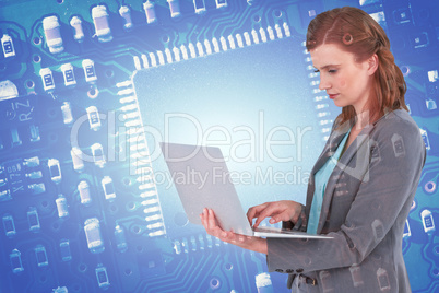 Composite image of businesswoman typing on laptop computer