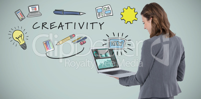 Composite image of rear view of businesswoman using laptop