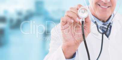 Composite image of happy doctor smiling at camera and showing his stethoscope