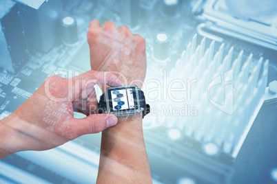 Composite image of cropped image of man using watch