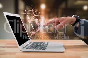 Composite image of businessman gesturing at laptop screen