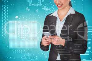 Composite image of smiling businesswoman holding mobile phone