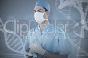 Composite image of surgeon wearing medical gloves and mask
